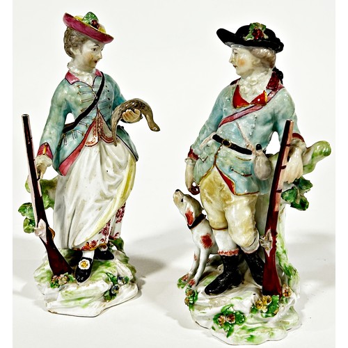 88 - A pair of Derby porcelain figures, sporting couple, 16cm high, together with a further porcelain fig... 