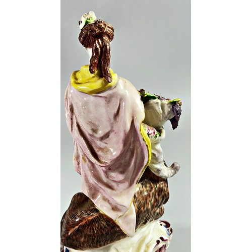 94 - An 18th century allegorical porcelain figure group, ‘Una And The Lion’, 24cm high.