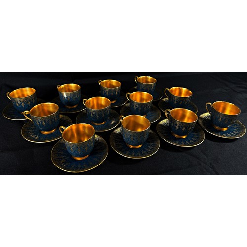 99 - A Royal Worcester cabinet porcelain coffee set, comprising eight cans and saucers, with gilt borders... 