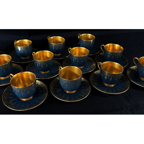 99 - A Royal Worcester cabinet porcelain coffee set, comprising eight cans and saucers, with gilt borders... 