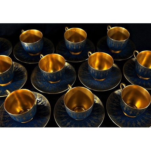 99 - A Royal Worcester cabinet porcelain coffee set, comprising eight cans and saucers, with gilt borders... 