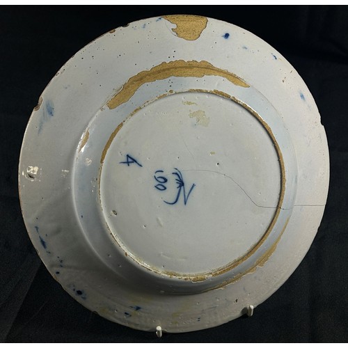 101 - An 18th century Delft plate, marked to underside, 24cm diameter, together with a small 19th century ... 