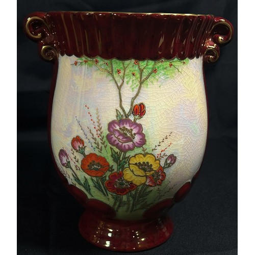 102 - A Carltonware ewer with moulded floral detail, 26cm high, together with a Crown Devon vase, 20cm hig... 