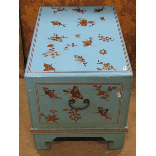 1189 - A contemporary Chinese chest with hinged lid and decorative floral and butterfly detail on a turquoi... 