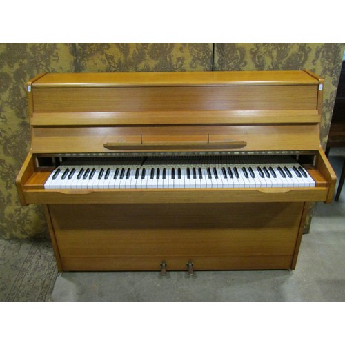 1193 - A Barrett and Robinson of London upright and overstrung piano in teakwood case, together with an ass... 