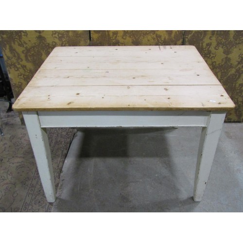 1197 - An antique pine scrubbed top kitchen table with rectangular boarded top, raised on later painted sup... 