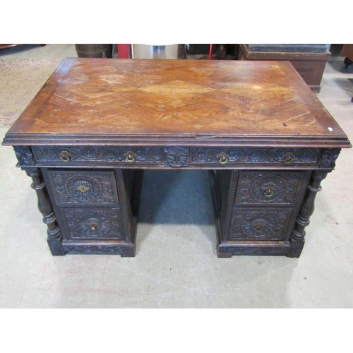 1198 - An antique oak kneehole twin pedestal desk with enclosed boarded back and carved detail, 73cm high x... 