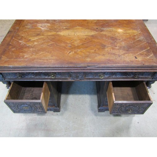 1198 - An antique oak kneehole twin pedestal desk with enclosed boarded back and carved detail, 73cm high x... 