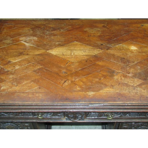 1198 - An antique oak kneehole twin pedestal desk with enclosed boarded back and carved detail, 73cm high x... 