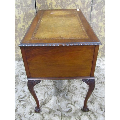 1203 - An Edwardian Georgian style kneehole writing table with inset leather top, over three frieze drawers... 