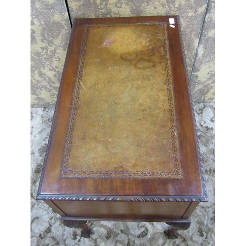 1203 - An Edwardian Georgian style kneehole writing table with inset leather top, over three frieze drawers... 