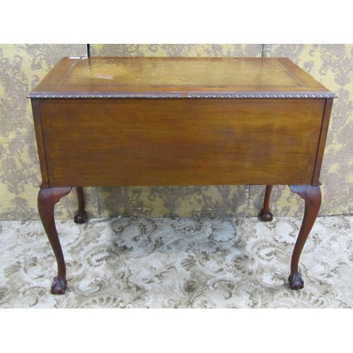 1203 - An Edwardian Georgian style kneehole writing table with inset leather top, over three frieze drawers... 