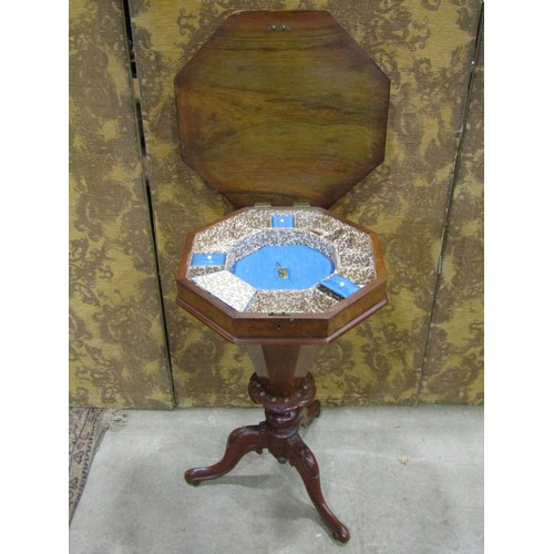 1204 - A Victorian walnut trumpet shaped sewing table of octagonal tapered form, raised on a carved and scr... 