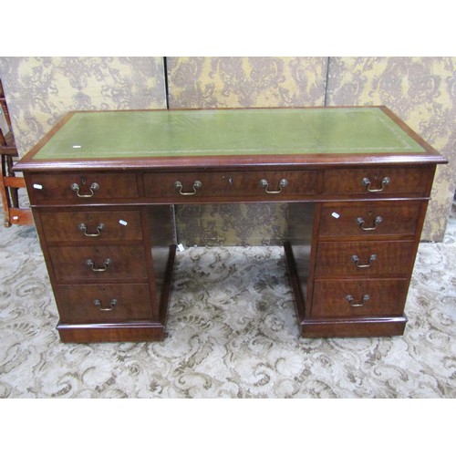 1207 - A Georgian style mahogany twin pedestal writing desk with inset leather top over an arrangement of n... 