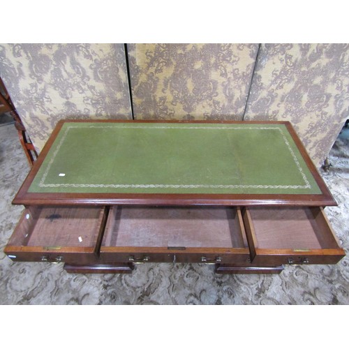 1207 - A Georgian style mahogany twin pedestal writing desk with inset leather top over an arrangement of n... 