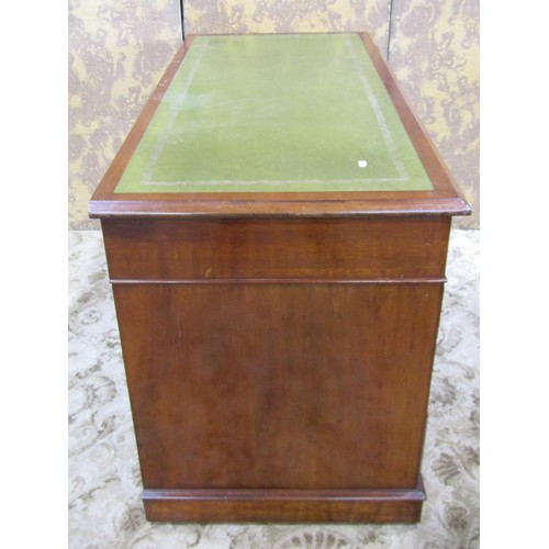 1207 - A Georgian style mahogany twin pedestal writing desk with inset leather top over an arrangement of n... 