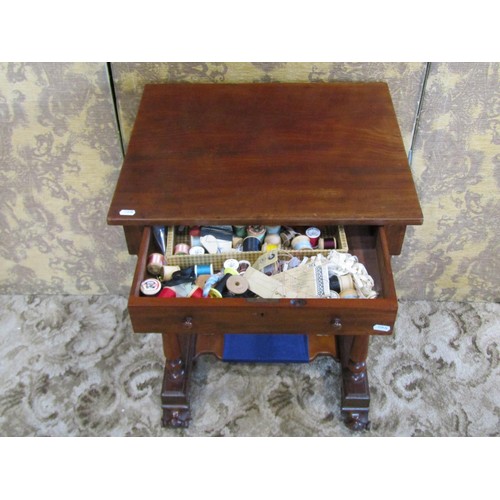 1208 - A 19th century mahogany sewing table fitted with one real and one dummy frieze drawer, raised on tur... 