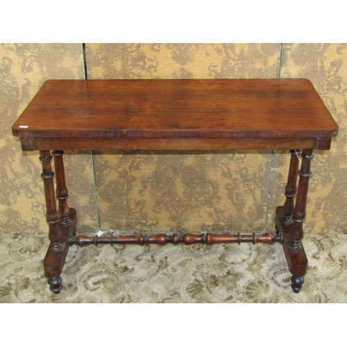 1209 - A 19th century rosewood stretcher table with rectangular top and turned supports, 68cm high x 97cm x... 