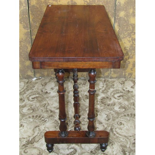 1209 - A 19th century rosewood stretcher table with rectangular top and turned supports, 68cm high x 97cm x... 