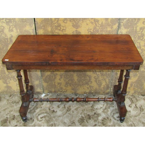 1209 - A 19th century rosewood stretcher table with rectangular top and turned supports, 68cm high x 97cm x... 