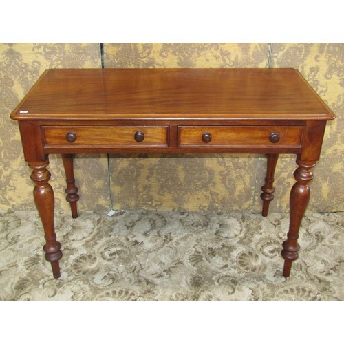 1210 - A Victorian mahogany side table with two frieze drawers on turned supports, 74cm high x 108cm x 53cm