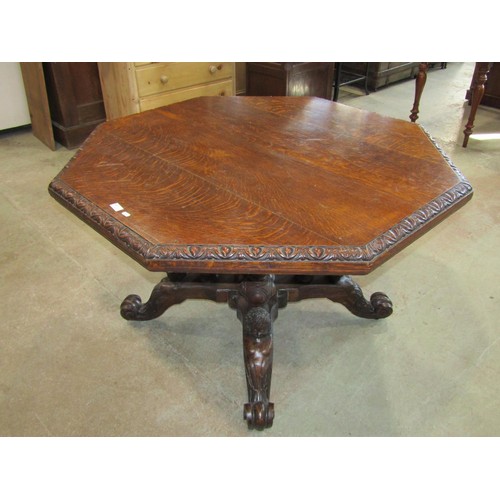 1212 - A Victorian oak centre table with octagonal top raised on spiral twist columns, set on a shaped plat... 