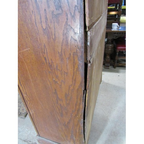 1216 - An Edwardian oak pantry cupboard enclosed by a pair of full length doors, with shelved interior (af)... 