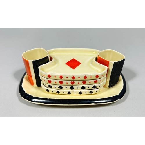 98 - A Royal Doulton novelty Art Deco playing card suit bridge set, containing four shaped dishes centred... 