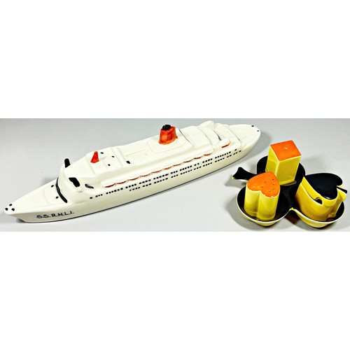 97 - A Carltonware porcelain model of a ship, ‘S.S R.N.L.I’, 37cm long and a novelty Carltonware playing ... 