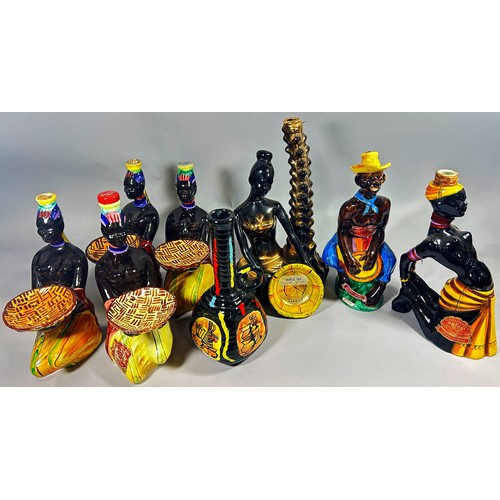 113 - A collection of novelty figural Italian porcelain Triple Sec and other bottles.