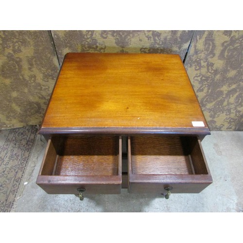 1226 - A small Edwardian mahogany chest of two long and two short drawers raised on squat cabriole supports... 