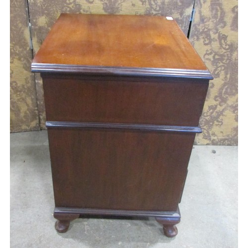 1226 - A small Edwardian mahogany chest of two long and two short drawers raised on squat cabriole supports... 