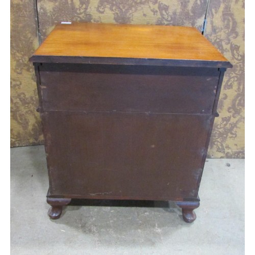 1226 - A small Edwardian mahogany chest of two long and two short drawers raised on squat cabriole supports... 