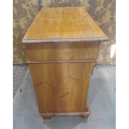 1227 - A 19th century continental stripped pine bedroom chest of three long and two short drawers flanked b... 