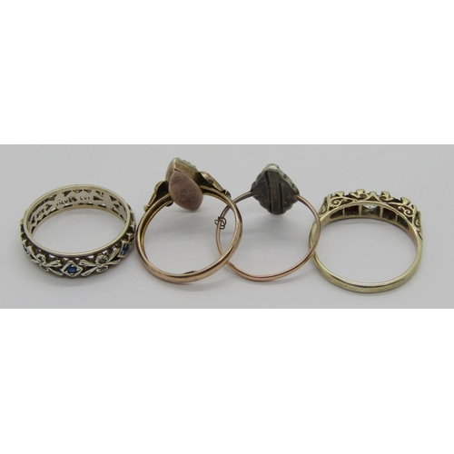 249 - Four stone set dress rings comprising a 9ct marquise shaped ring (af) and three 9ct and silver examp... 