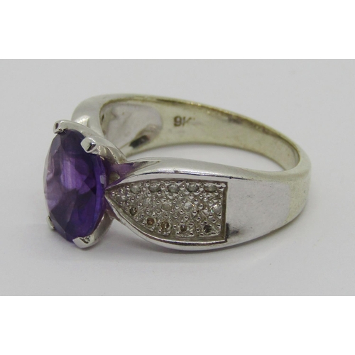 257 - 9ct white gold oval amethyst and pavé set diamond dress ring, maker 'GA', Sheffield, size P, 5.8g