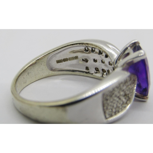 257 - 9ct white gold oval amethyst and pavé set diamond dress ring, maker 'GA', Sheffield, size P, 5.8g