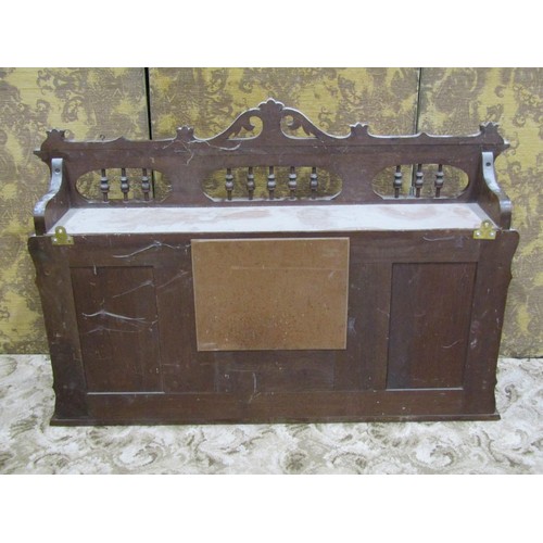 1234 - An Edwardian walnut overmantel (probably removed from a harmonium), decorative outline, central mirr... 