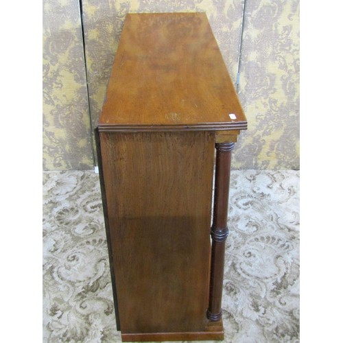 1237 - A dwarf floor standing open mahogany bookcase with turned columns flanking a fixed shelf, 80cm high ... 