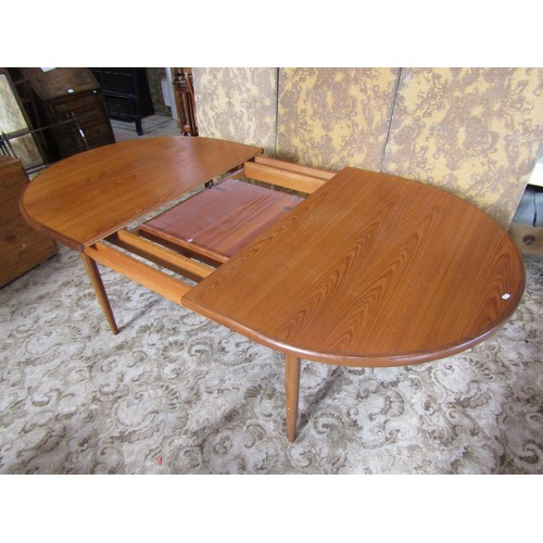 1245 - A G Plan teak D end pull out extending dining table with single additional bi-fold leaf, raised on s... 