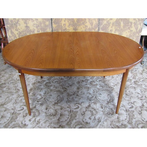 1245 - A G Plan teak D end pull out extending dining table with single additional bi-fold leaf, raised on s... 