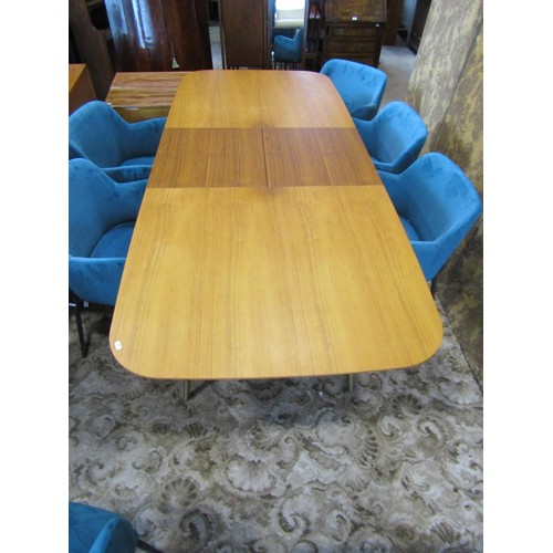 1249 - A contemporary retro style pull-out extending dining table with single additional bi-fold leaf raise... 