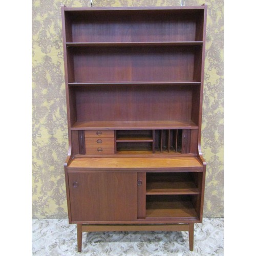 1250 - 1970s teak free standing lounge unit, partially enclosed by sliding and tambour doors revealing a pa... 