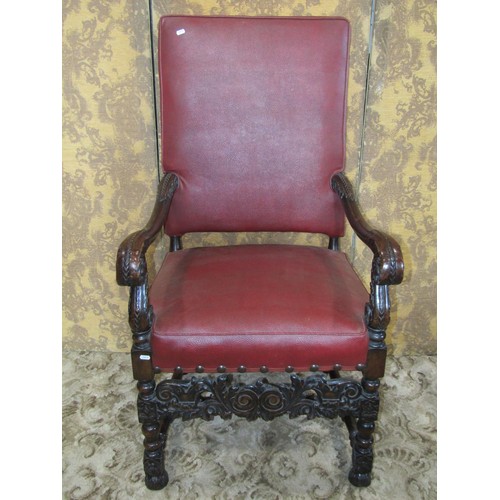 1254 - A carolean style open armchair with red faux leather upholstered seat and back within a carved frame... 