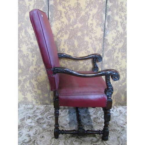 1254 - A carolean style open armchair with red faux leather upholstered seat and back within a carved frame... 