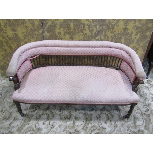 1258 - An Edwardian low backed parlour/bedroom sofa with repeating light pink ground upholstered seat, back... 