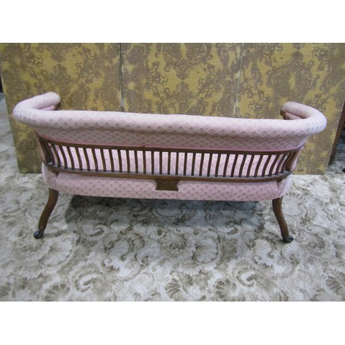 1258 - An Edwardian low backed parlour/bedroom sofa with repeating light pink ground upholstered seat, back... 