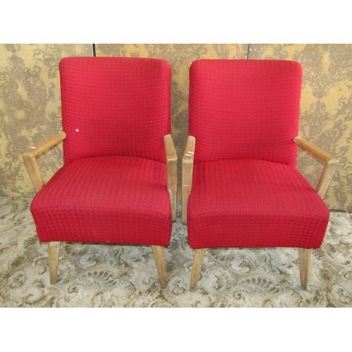 1259 - A pair of mid-century red twill upholstered open armchairs with beech wood frames