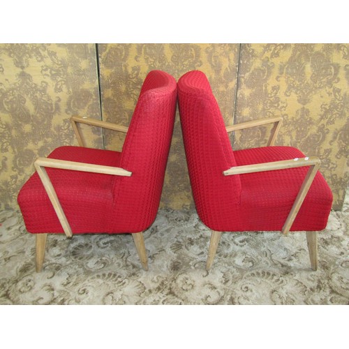 1259 - A pair of mid-century red twill upholstered open armchairs with beech wood frames