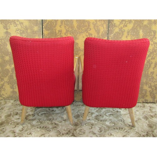 1259 - A pair of mid-century red twill upholstered open armchairs with beech wood frames